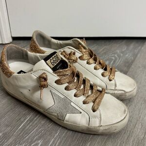 Golden Goose Cream and Gold Superstars